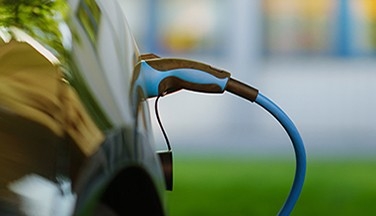 Electric vehicle being charged.